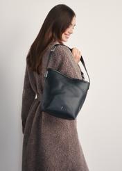 Black women's shoulder bag TOREC-1093-99(Z25) - front view of the product on a model against a white background. Half of the silhouette visible from the side.