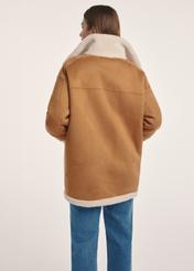 Women's double-sided sheepskin coat KOZDP-0009-24(Z24), view of the product from the back on the model, half of the silhouette visible.