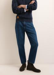Blue men's denim pants JEAMT-0026-7C(Z26), front view of the product on the model. Half of the silhouette visible.