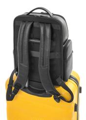Black spacious men's backpack PLCMS-0022-99(Z25), product view from the back on a suitcase on a white background.