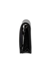 Black leather women's wallet PORES-0944G-99(Z25), product view from the side on a white background.