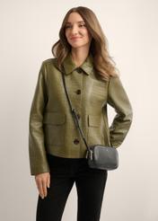 Small black leather handbag TORES-1152-99(W26), product view on model's shoulder. Half of silhouette visible.