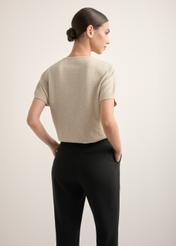 Beige women's knit blouse BLUDT-0214-1A(Z26), back view of the product on the model. Half of the silhouette visible.