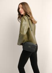 Small black women's handbag TOREC-1285-9I(Z26), product view on model's shoulder. Half of silhouette visible.