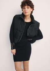 Black women's vest KAMDT-0033-99(Z25), front view of the product on the model. Half of the silhouette visible.
