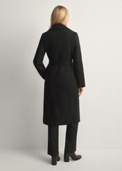 Black long women's coat PLADT-0048B-99(Z25), product view from the back on the model, the whole silhouette is visible.