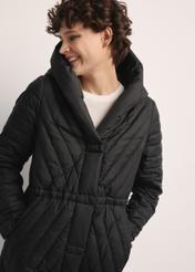 Long women's jacket with quilting KURDT-0523-98(Z25), close-up of this product on a model.