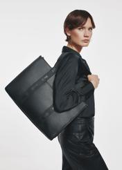 Black large shopper bag TOREC-0977A-99(Z25) - front view of the product on a model on a white background.