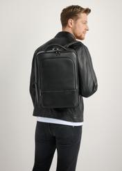 Men's Black Leather Backpack PLCMS-0024-99(W26) - front view of the product, modeled against a light background. Knee-length silhouette visible.