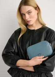 Blue small women's handbag TOREC-1172-7C(W26), product view in model's hand. Half of silhouette visible.