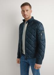 Men's navy blue quilted jacket KURMT-0327-7C(W26) - front product view, modeled, against a light background. Knee-length silhouette visible.