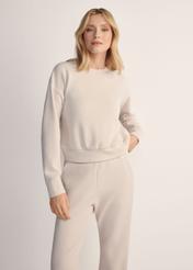 Light beige women's sweatshirt BLZDT-0119-1A(Z26), front view of the product on the model. Half of the silhouette visible.