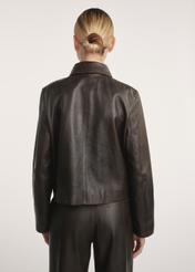 Brown women's leather short jacket KURDS-0552-2868(Z25) - product view from the back on the model. Half of the silhouette visible.