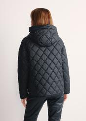 Black women's quilted jacket with hood KURDT-0588-99(Z25), back view of the product on a model, half of the silhouette visible.