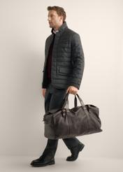 Brown leather travel bag TORMS-0520-1H(Z26), front view of the product in the model's hand.