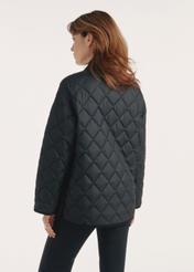 Black women's quilted jacket with hood KURDT-0588-99(Z25), product view from the back on the model, half of the silhouette visible.-02