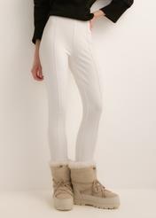 Cream-colored, fitted women's trousers SPODT-0096-0B(Z26); front view of the product on a model. Half-body shot.