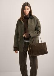 Women's brown suede shoulder bag TORES-1423-1I(Z26), front view of the product on a model. Half of the silhouette visible.
