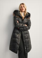 Black women's winter jacket with natural fur KURDT-0618-99(Z25), front view of the product on the model, half of the silhouette visible.