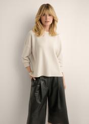 Light beige women's sweater SWEDT-0263-1A(Z26), front view of the product on the model. Half of the silhouette visible.