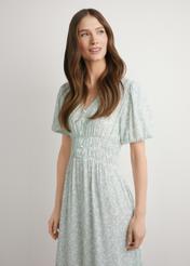 Sage floral long dress SUKDT-0191-8P(W26), front view of the product on the model. Half of the silhouette visible.