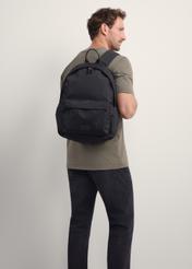 Black men's backpack TORMN-0383-99(Z25), product view on model. Half silhouette visible.