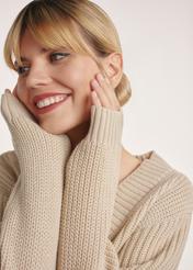 Beige women's V-neck sweater SWEDT-0162-80(Z25), product visible from the side on the model, close-up of the model's face and hands.