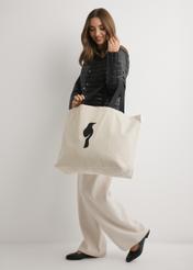 Cream cotton bag TOREN-0136-0C(W26), product view on model's shoulder. Full body visible.