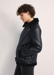 Black short women's sheepskin coat KOZDP-0001A-99(Z24), side view of the product on the model, half of the silhouette visible.