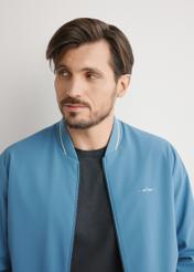 Blue men's nylon jacket KURMT-0416-7C(W26), close-up of the product on the model's silhouette.