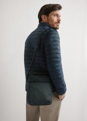 Men's black crossbody bag TORMN-0395-9J(W26) - front product view, on model, against a light background. Half-length silhouette visible.