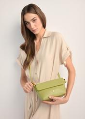 Small lime green women's shoulder bag TOREC-0916-8G(W26), product view on model's shoulder. Half silhouette visible.