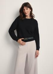 Black women's sweater SWEDT-0238-99(Z25), front view of the product on the model. Half of the silhouette visible.
