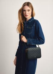 Women's black monogram messenger bag TOREC-0205F-98(Z25), product view on model's shoulder. Half silhouette visible.