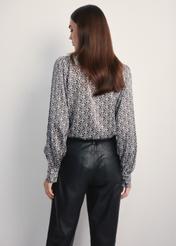 Women's shirt with monogram KOSDT-0175-96(Z25), product view from the back on the model, half of the silhouette visible.