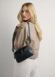 Medium black women's handbag TOREC-1121-9F(W26), product view on model's shoulder. Half of silhouette visible.