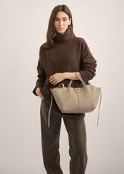 Women's dark beige handbag TOREC-1231-1K(Z26). Product view from the front on a model, half of the silhouette visible.