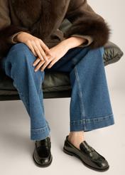 Women's black leather moccasins BUTYD-1355-9F(Z26), front view of the product on the model's feet, on a light background.