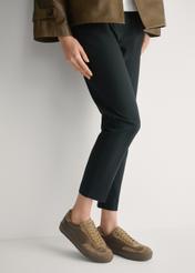 Women's leather sneakers in cool beige color BUTYD-1260-1K(W26), side view of the product on the model's feet.