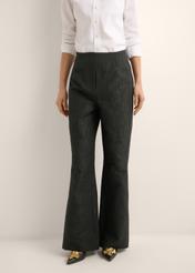 Black floral wide leg trousers SPODT-0127-99(Z26), front view of the product on the model. Half of the silhouette visible.