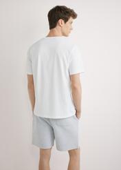 Men's white T-shirt with print TSHMT-0145-0A(W26), back view of the product on the model. Half of the silhouette visible.