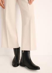 Black leather women's ankle boots BUTYD-1193-99(Z25), product view on model's feet against a light background.