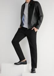 Men's black leather moccasins BUTYM-0482-99(W25), side view of the product on the model, half of the silhouette visible.