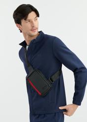 Black small men's messenger bag TORMN-0344-99(W25), front product view on the model. Half of the silhouette visible.