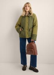 Light brown women's backpack TOREC-1263-1G(Z26), front view of the product on a model. Full body visible.
