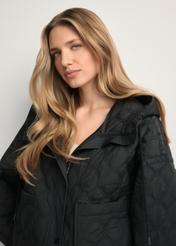 Black short oversize quilted jacket KURDT-0660-99(W26) - front view of the product, on a model, against a light background. Close-up.