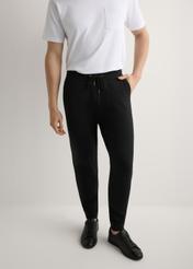 Men's black sweatpants SPOMT-0017-99(W26), product view from the front on the model, half of the silhouette visible.