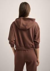 Brown women's hooded sweatshirt BLZDT-0118-1H(Z26), product view from the back on the model. Half of the silhouette visible.
