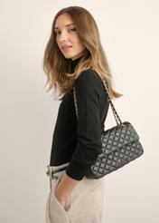 Black quilted chain bag TOREC-0443D-99(W25), diagonal view of the product on the model. Half of the silhouette visible.