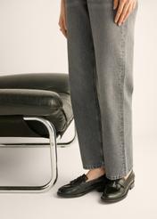 Women's leather moccasins with tassel BUTYD-1295-9F(Z26), side view of the product on the model's feet.